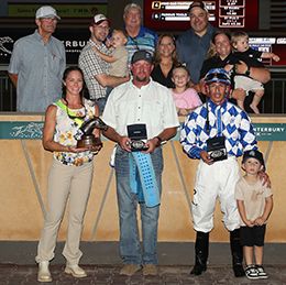The winning connections of Foxy Cowgirl accept the $38,148 Grade 3 Cox Ranch Canterbury Park Distaff Challenge winning trophy Thursday.