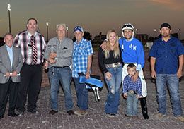 The winning connections A Legacy Of Tales accept the Two Rivers Stakes trophy.