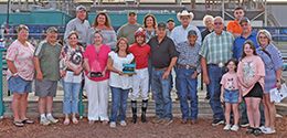 The winning connections of R Cowgirl accept the $19,420 Masterpiece Derby trophy at Fair Meadows on Saturday.