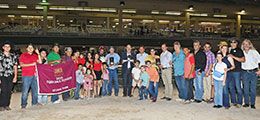 The winning connections of A Maverick accept the TQHA Sale Futurity stakes trophy at Retama Park Saturday night.