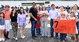 The winning connections of Rc Coronado accept the Leon Bard Memorial Stakes trophy on Saturday.