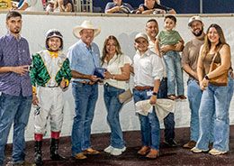 The winning connections of Jes Winnin Cartel accept the Audubon Stakes trophy at Delta Downs Saturday night.