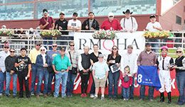 The winning connections of Sheza Fearless Eagle accept the Lucille Rowe Derby stakes trophy on Sunday.