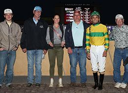 Holy The winning connections of Holy Dynasty accept the North Star State Derby stakes trophy Wednesday at Canterbury Park.