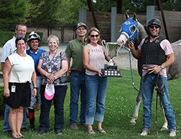 The winning connections of Elvis The Famous accept the $43,465 (US) Ontario Bred Futurity trophy at Ajax Downs on Wednesday.