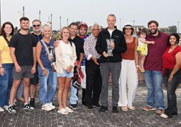 The winning connections of Ajs Favorite Ia accept the Cy-Hawk Stakes trophy on Saturday.