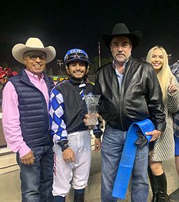 Roman Figueroa, Edwin Escobedo, Marc Jungers and Kaylee Escobedo accept the trophy after Train B Taka won the $25,000 Holiday Handicap Los Alamitos on Saturday.
