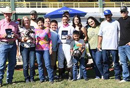 The winning connections of Wynnchester accept the $26,554 Q-Racing Will Rogers Distance Challenge trophy at Will Rogers Downs on Sunday.