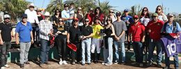 The winning connections of Jess Mr Mayito accept the $22,500 Mark Villa Maiden Stakes trophy at Turf Paradise on Monday.