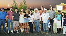 The winning connections of Hes.A Jet One accepts the Dr. Glenn Blodgett Stakes trophy at Lone Star Park.