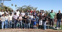 The winning connections of Four Sweet Kid accept the Desert Classic Dderby stakes trophy at Turf Paradise.