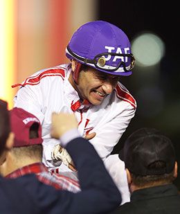 Champion jockey James Flores receives congratulations after winning Oklahoma's richest race at Remington Park Saturday.