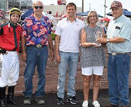 The winning connections of Winnemuca accept the Prairie Meadows Gold Juvenile stakes trophy.