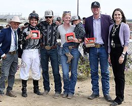 The winning connections of Mi Leaving You accept the Energy Downs Futurity trophy at Sunday.