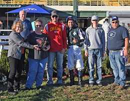 The winning connections of Apollitical Payoff accept the $26,350 OQHRA Fall Classic Stakes trophy at Will Rogers Downs on Sunday.