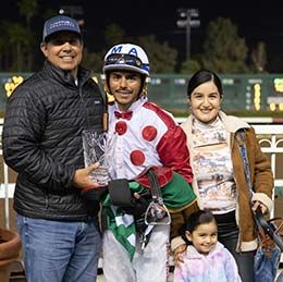 Trainer Juan Aleman, jockey Martin Arriaga and family accept the Moonist Stakes trophy Sunday night at Los Alamitos Rae Course