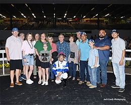 The winning connections of Chieftainess accept the $52,000 John Buchanan Memorial Stakes trophy at Sam Houston on Saturday.