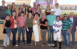 The winning connections of Sugar Rushh accept the $48,000 Minnesota Quarter Horse Derby trophy at Canterbury Park on Saturday.