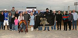 The winning connections of Rock N The Beach accept the Miss Roxie Little Futurity stakes trophy at Horseshoe Indianapolis.