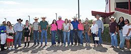 The winning connections of West Tx Rain accept the Zia 870 Championship stakes trophy.