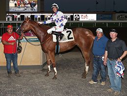 The winning connections of Aj Fast Corona accept the $35,904 Canterbury Park Distaff Challenge Stakes [G3] trophy at Canterbury Park on Wednesday.