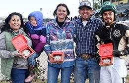The winning connections of Jkh Almost A Dynasty accept the Wyoming Oaks stakes buckles on Friday at Energy Downs 307 Racing.