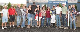 The winning connections of Love Kiss J Lee accept the Sweetwater Downs QH Maturity trophy on Sunday.