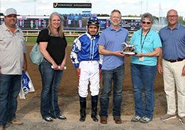 The winning connections of Jolie Laide accept the Horseshoe Indianapolis QHRAI Derby stakes trophy.