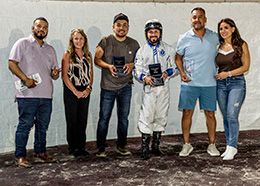The winning connections of Chilley accept the $112,225 Old South Derby trophy at Delta Downs on Friday.