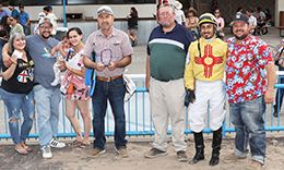 The winning connections of Bv Mexican Foose accept the $170,881 Four Corners Futurity-G3 trophy at SunRay Park on Saturday.