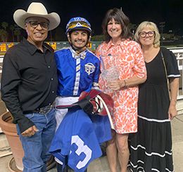 Roman Figueroa, Edwin Escobedo, Brenda Figueroa and Shonna Smith accept the trophy after Train B Taka won the Dillingham Stakes at Los Alamitos on Saturday.