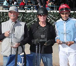 The winning connections of Rock Ya Later accept the $100,000 King Rick Rack Stakes trophy at Zia Park on Sunday.