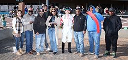 The winning connections of Flashtoglroy accept the $100,000 New Mexico Classic Distaff Stakes trophy at Zia Park on Sunday.