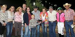The winning connections of The Grand Legend accept the Let "Er Rip Chip Lip Stakes trophy at Lone Star Park.