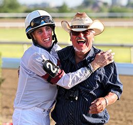 Jockey Brian Bell and trainer Joe Tavares celebrate after winning the Ontario Bred Maturity.