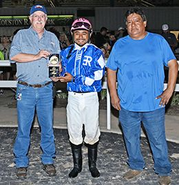 The winning connections of Onthrocks accept the Sam Houston 550 Stakes trophy on Saturday at Sam Houston Race Park