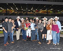 The winning connections of Top Shelve accept the $104,704 John Deere Sam Houston Juvenile trophy at Sam Houston on Saturday.