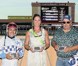 The winning connections of Ur Favorite accept the MQHRA Stallion Auction Futurity stakes trophy on Thursday at Canterbury Park.