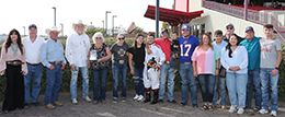 The winning connections of Fine Am Eye accept the $50,000 Champagne Lane Stakes trophy at the Downs At Albuquerque on Sunday.
