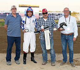 The winning connections of Sawyer Strange accept the $28,050 Cox Ranch Distaff Regional Challenge trophy at Horseshoe Indianapolis on Thursday.