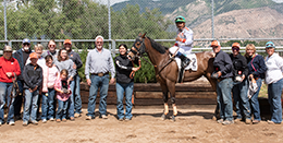 The winning connections of High Flying Storm accept the Golden Spike Derby stakes trophy at Weber Downs Saturday.