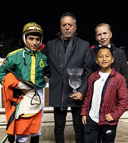 EG High Desert Farms' Enrique Gonzales and family with jockey Ricardo Ramirez.