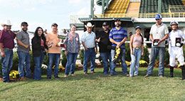 The winning connections of Kvn Design accept the OQHRA Mystery Futurity stakes trophy on Monday at Will Rogers Downs.