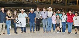 The winning connections of Hes A Jet One accept the TQHA Classic Stakes trophy on Friday at Retama Park.