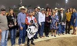The winning connections of Fire Of The Mountain in the Blane Schvanelvedt Handicap winner's circle.