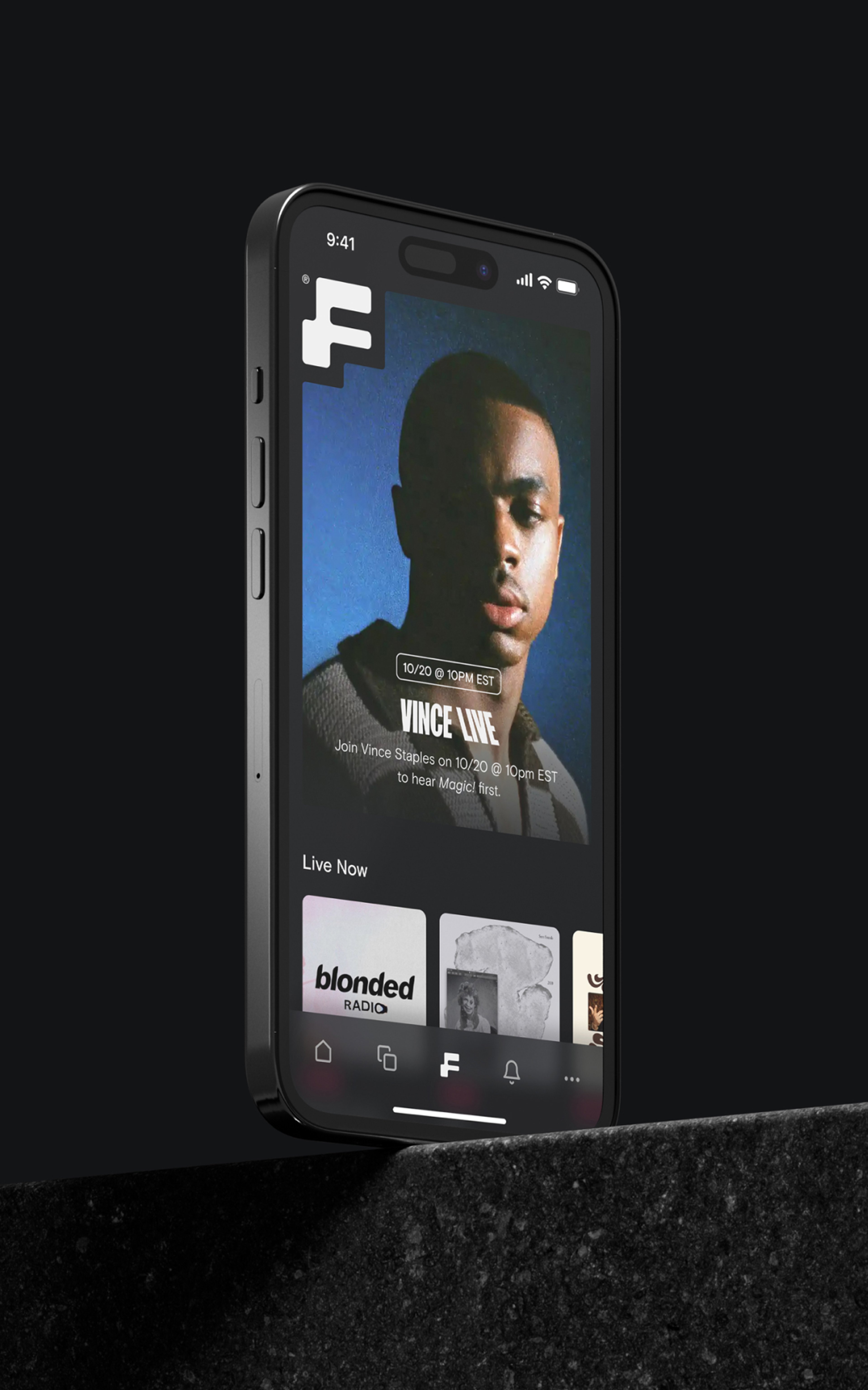 iPhone stood on a cement block displaying the Found music streaming app