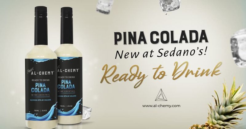 Pina Colada ad with two bottles and some ice cubes with a pineapple