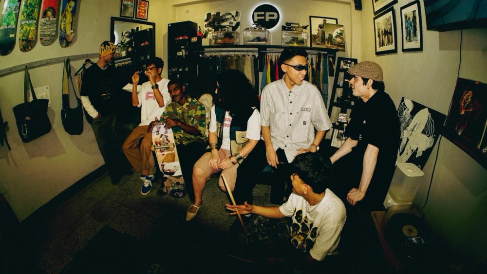 Interior of FP Skate Shop with skaters and boards