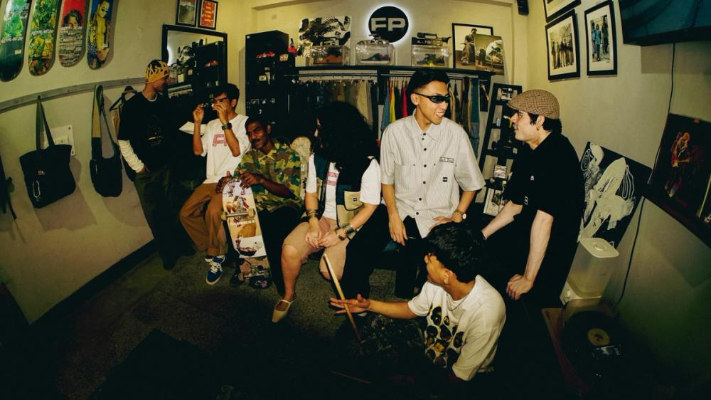 Interior of FP Skate Shop with skaters and boards