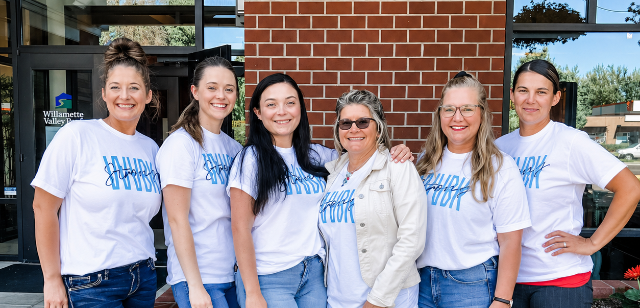 Willamette Valley Bank employees wearing matching branded shirts at a company event.